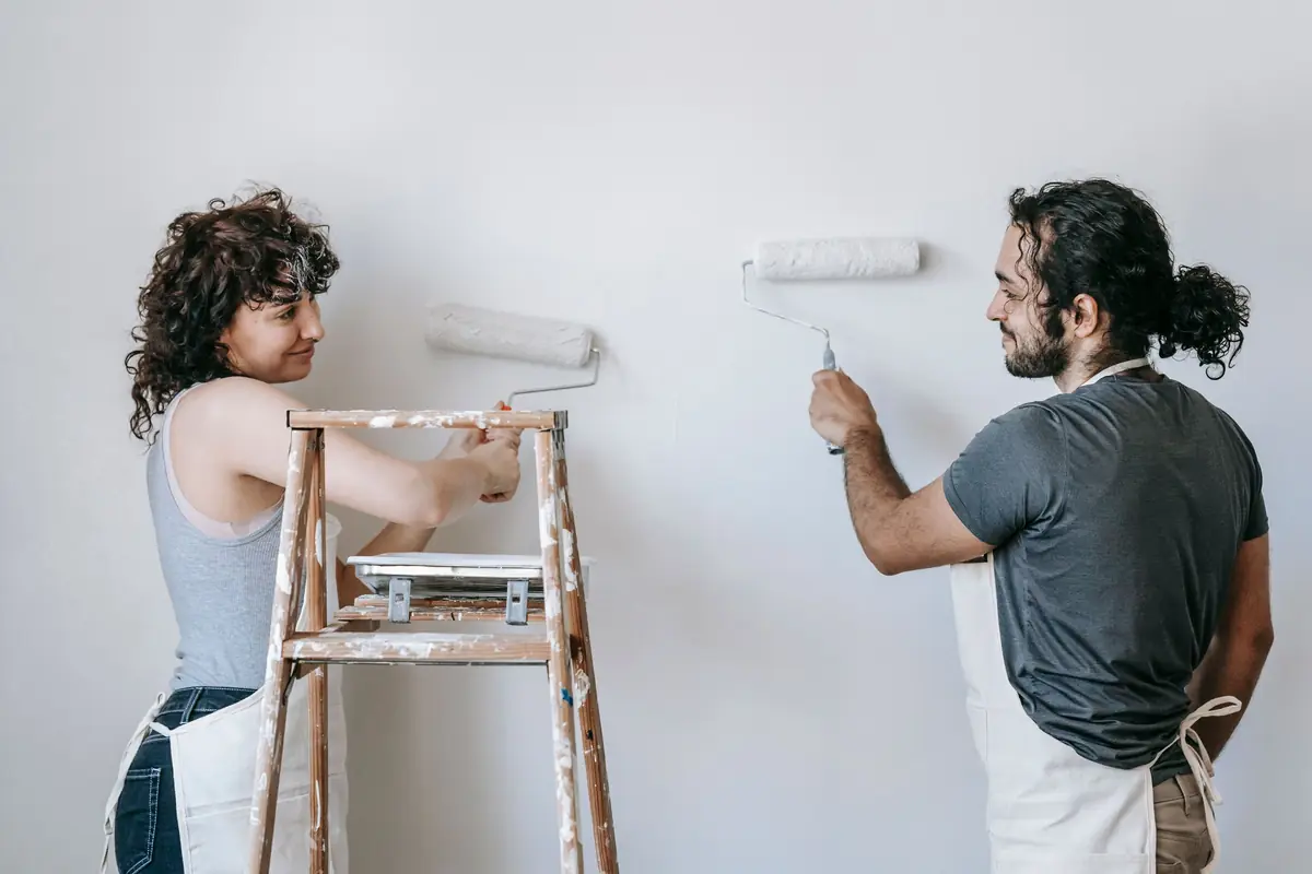People painting a wall together — painting help in Birmingham